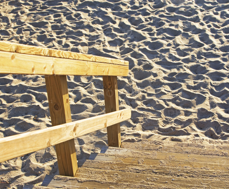 Wooden steps down to sand. Date : 2008