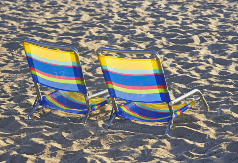 Empty beach chairs on sand. Date : 2008