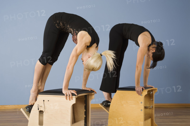 Women exercising in pilates class. Date : 2008
