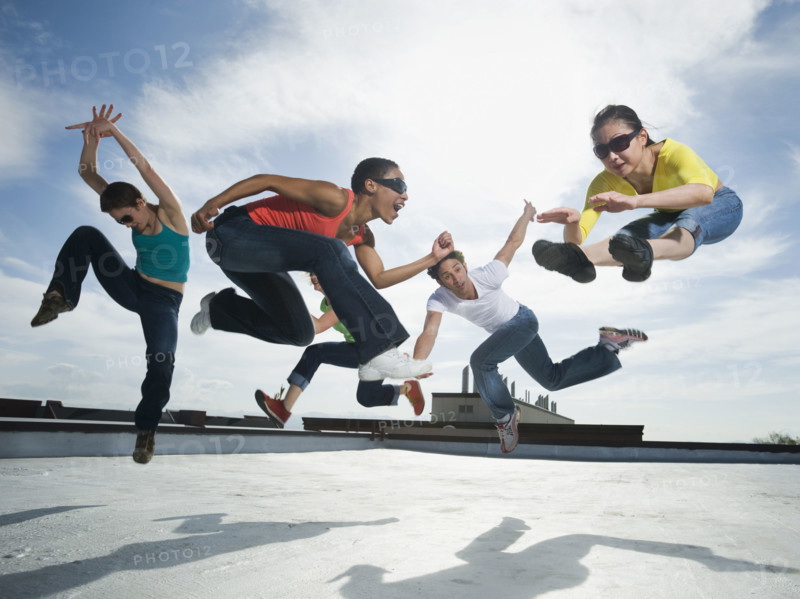 Multi-ethnic group performing modern dance. Date : 2008