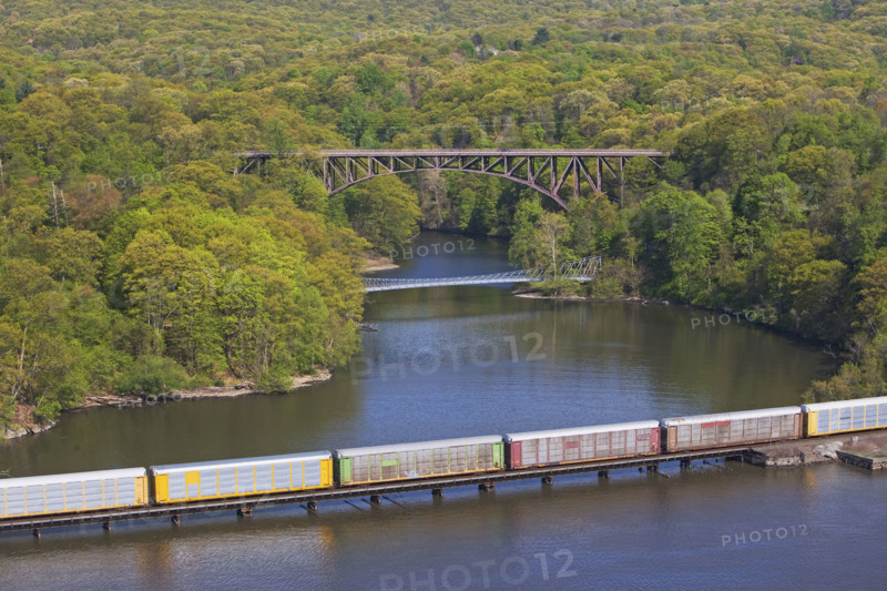 Cargo train on rail over river, New York, United States. Date : 2008