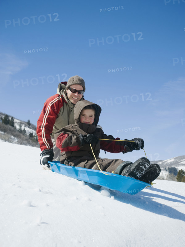 Father and son on sled. Date : 2008