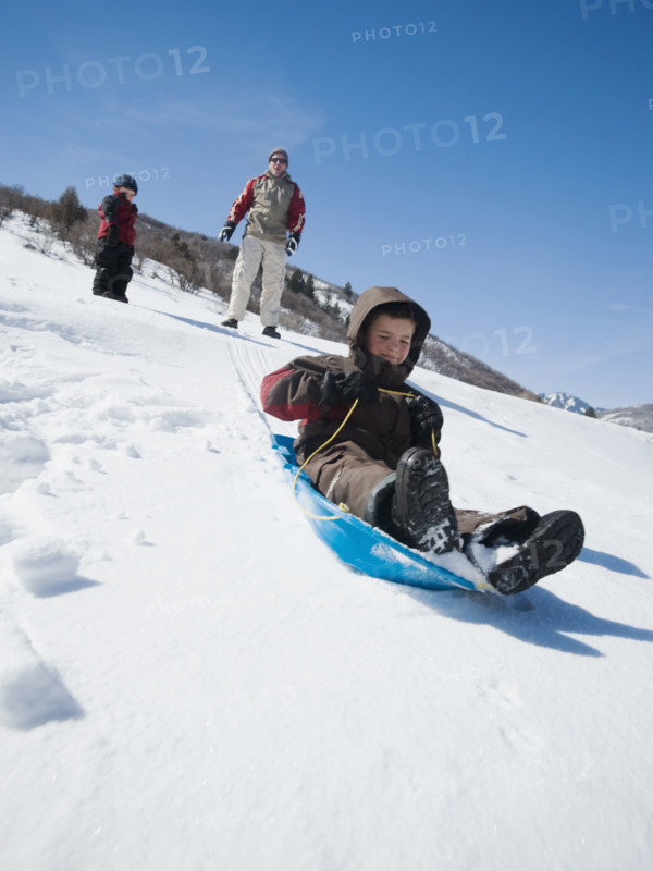 Boy riding on sled. Date : 2008