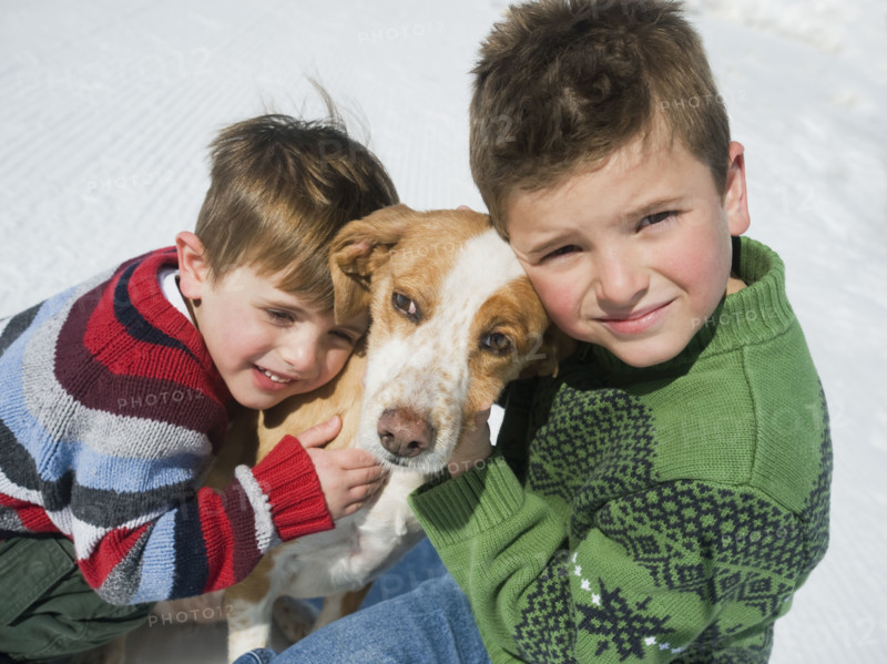Brothers hugging dog. Date : 2008