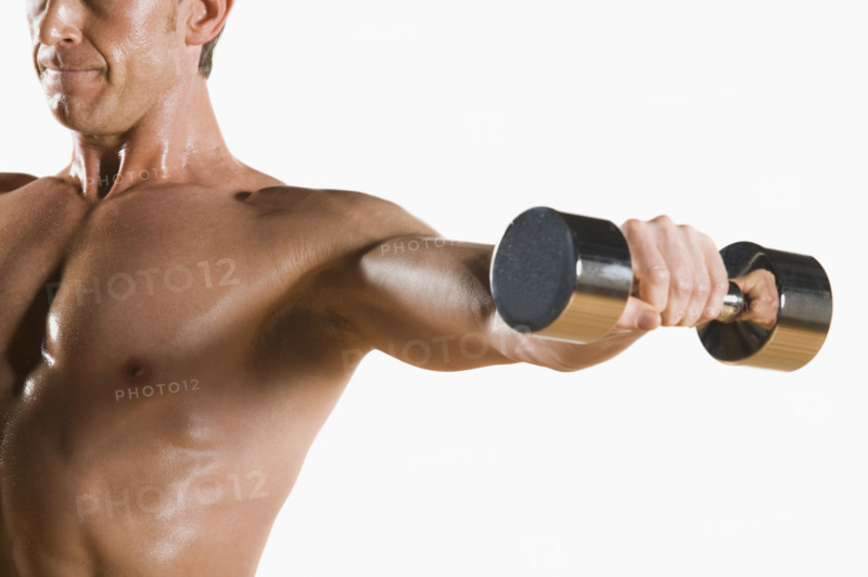 Male body builder flexing lifting weight. Date : 2008