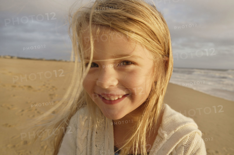 Girl laughing at beach. Date : 2008