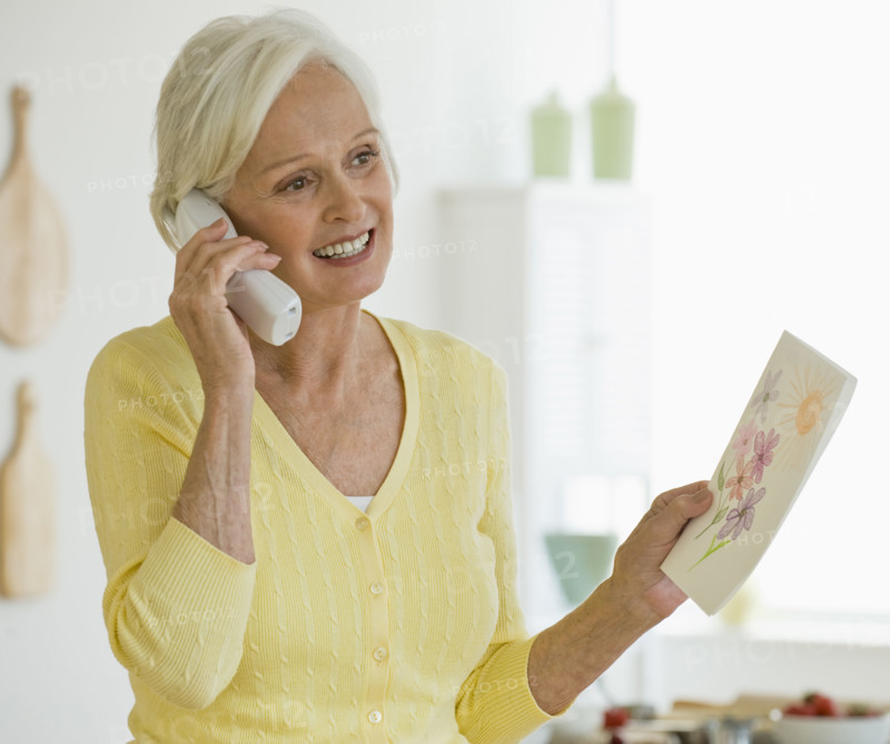 Woman talking on telephone.