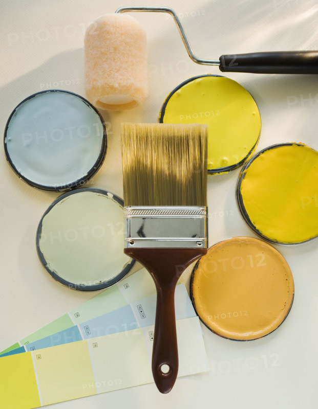 Paintbrushes and assorted paints.