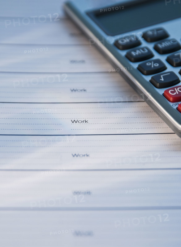Close up of datebook and calculator. Date : 2008