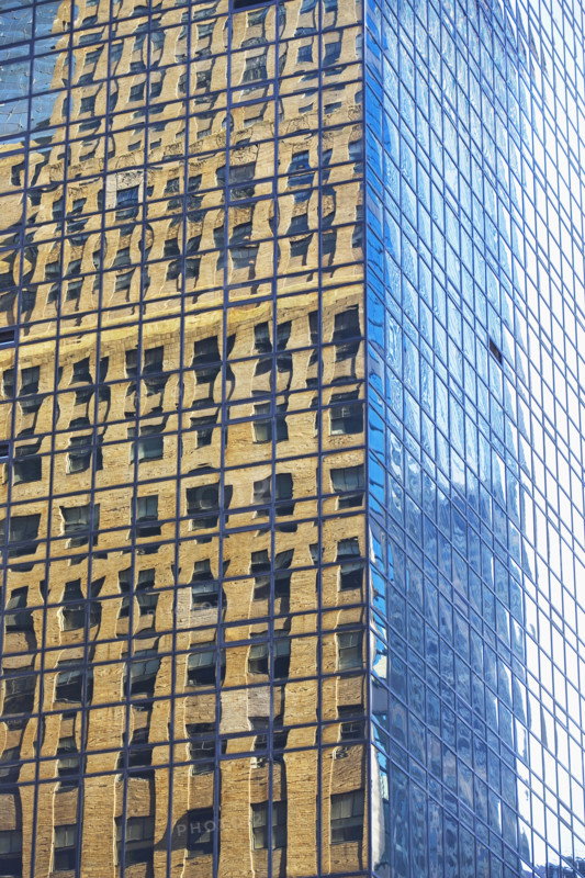 Old building reflected in modern building windows. Date : 2008