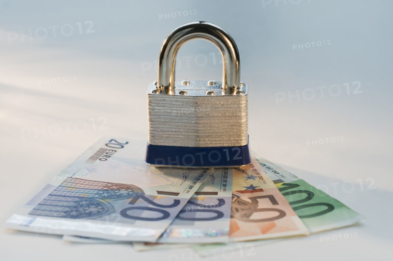 Close up lock and paper euros. Date : 2008