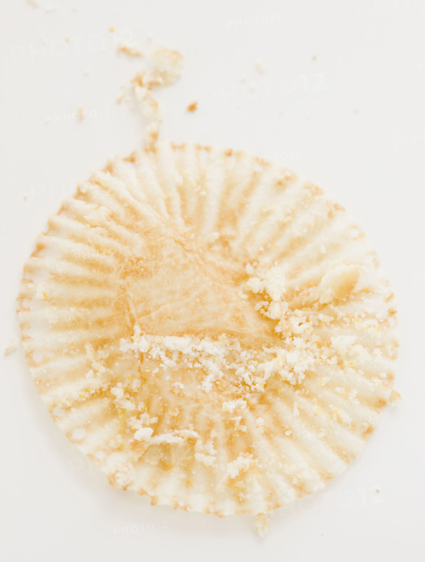 Close up of crumbs on muffin wrapper. Date : 2008