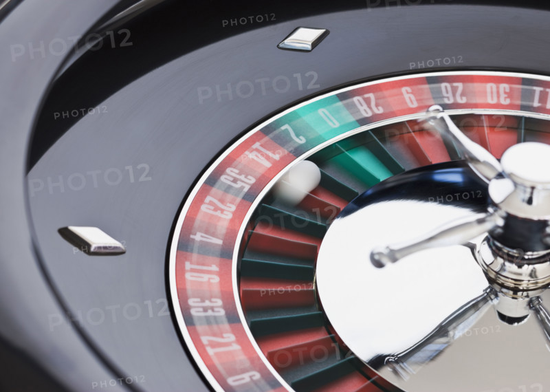 Close up of spinning roulette table.