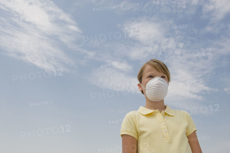 Girl wearing dust mask.