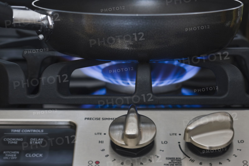 Close up of skillet on gas stove.