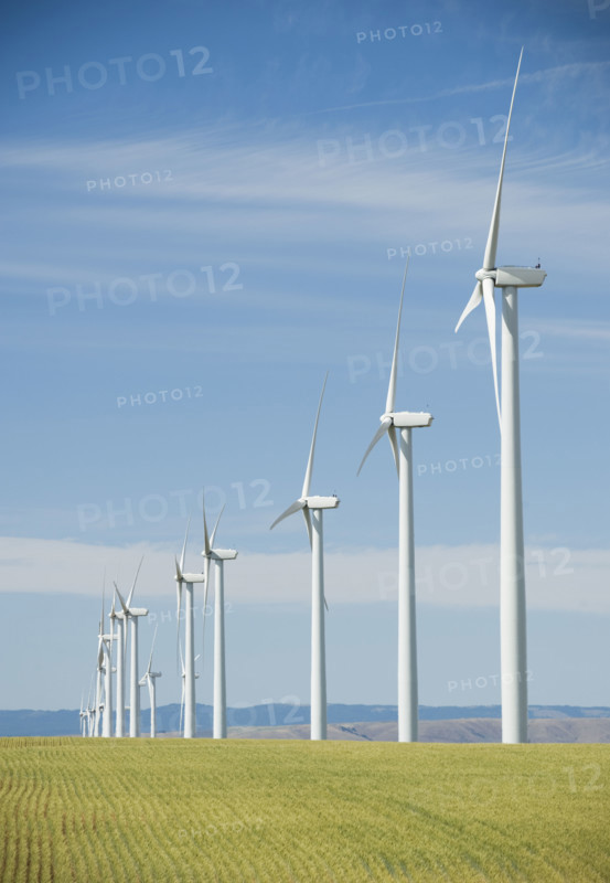 Windmills in a row on wind farm. Date : 2008