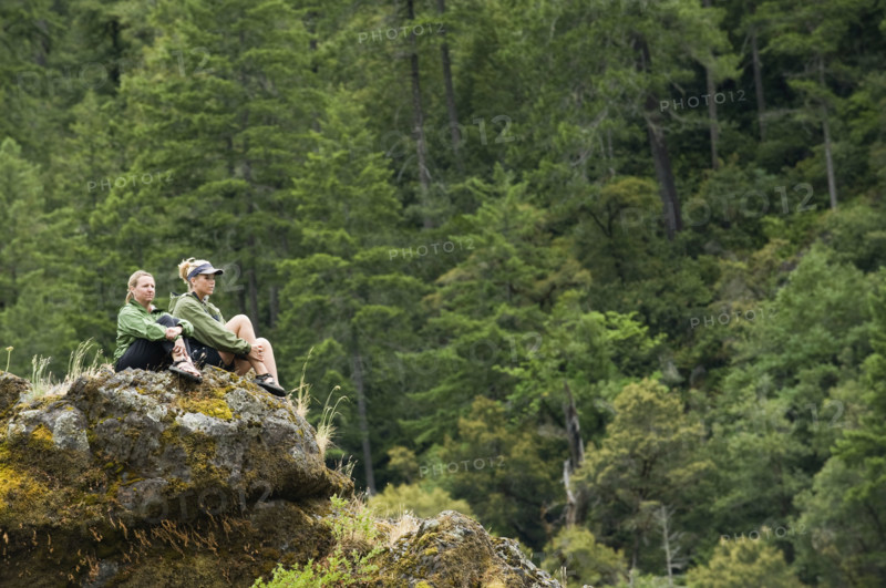Hikers enjoying view from rock outcropping. Date : 2008