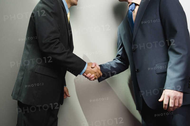Businessmen shaking hands. Date : 2008