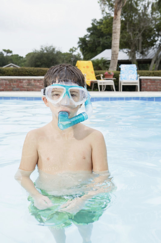 Boy snorkeling in swimming pool. Date : 2008