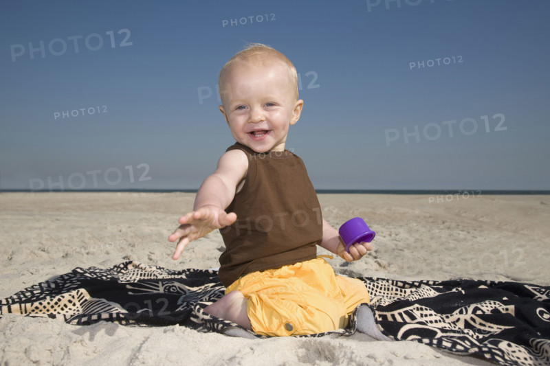 Baby boy playing at beach. Date : 2008