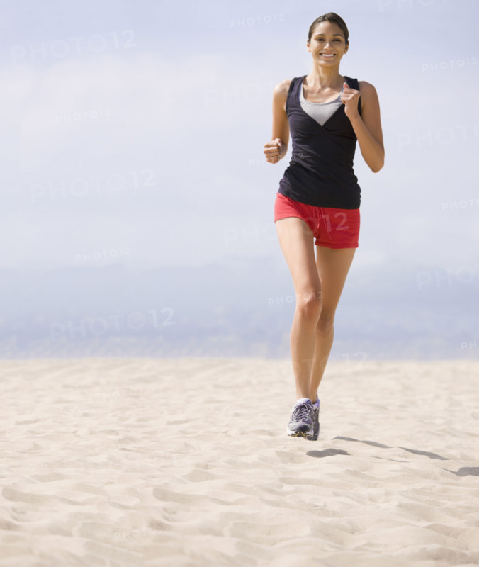 Woman running on beach. Date : 2008