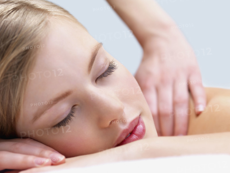 Young woman getting massage. Date : 2008