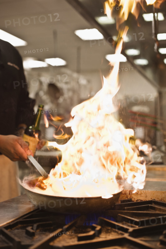 Chef cooking with flame. Date : 2008