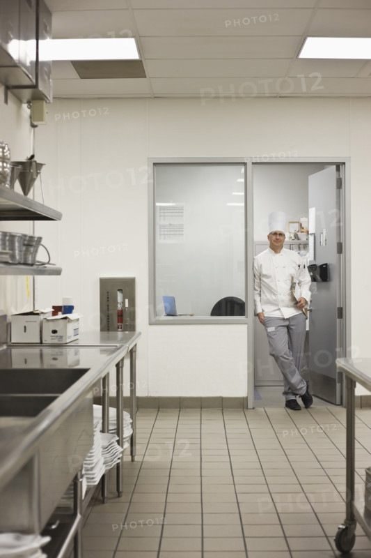 Chef standing in doorway of kitchen office. Date : 2008