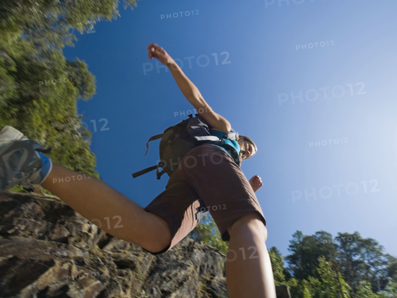 Low angle view of female hiker. Date : 2008