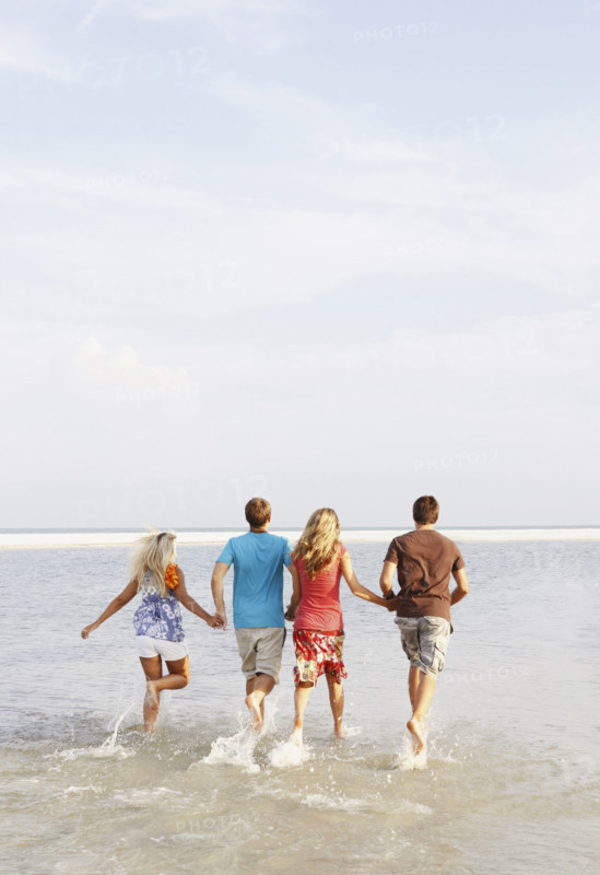 Friends running in ocean. Date : 2008