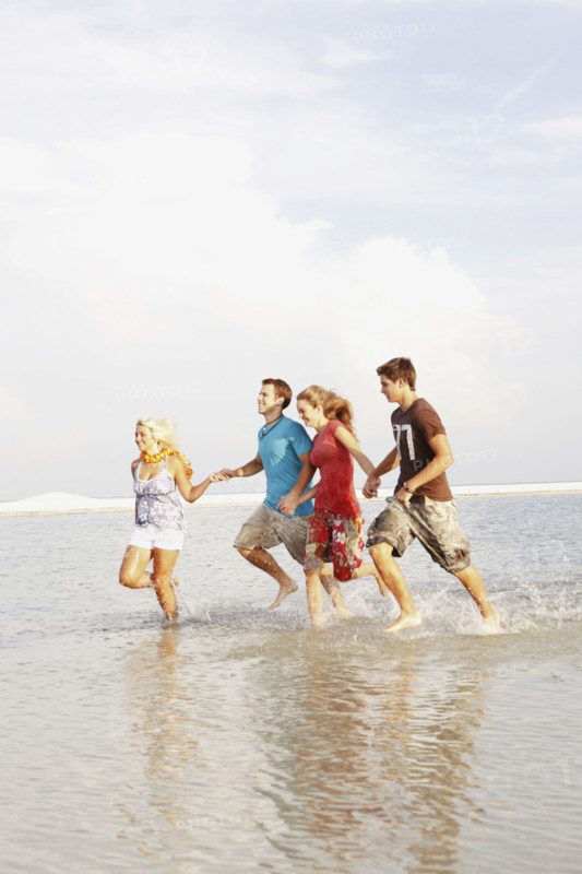 Friends running in ocean. Date : 2008