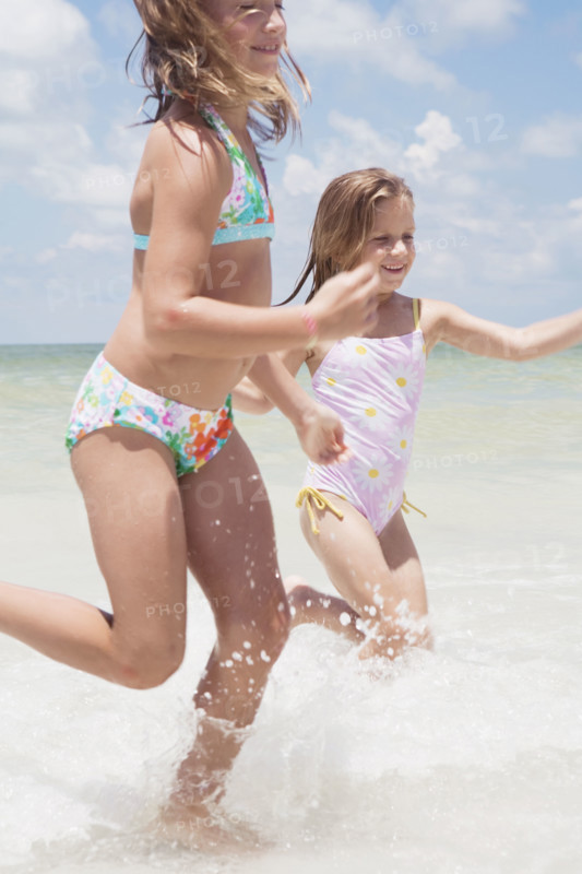 Girls running in ocean. Date : 2008