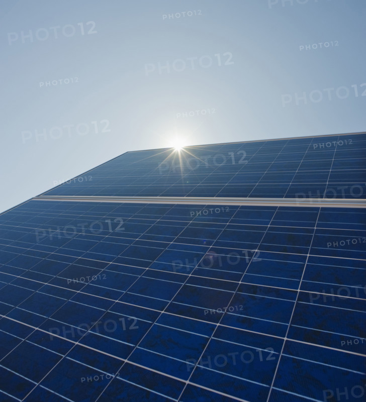 Sun shining on solar panel.