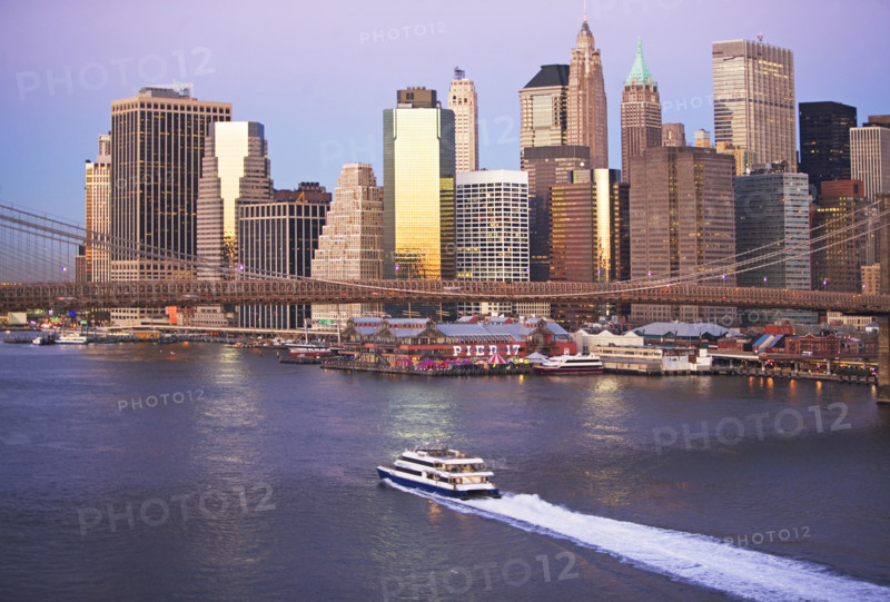 Boat passing under Brooklyn Bridge. Date: 2008