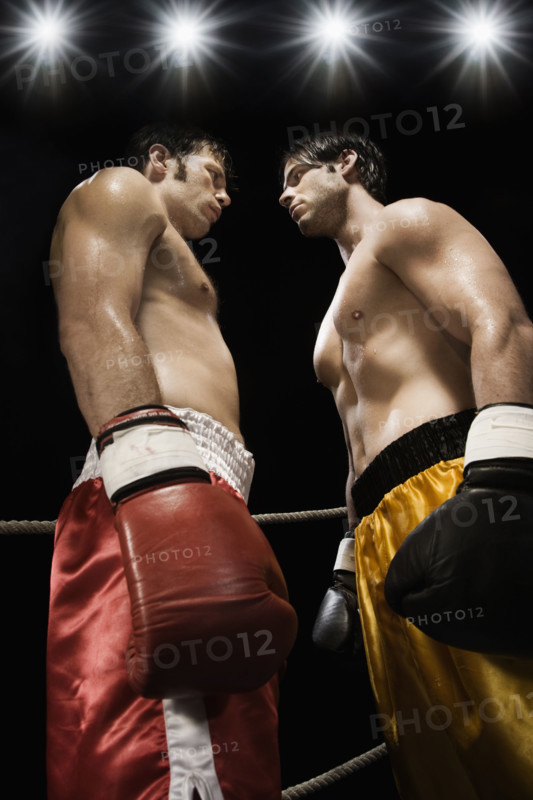 Boxers facing off in boxing ring. Date : 2008