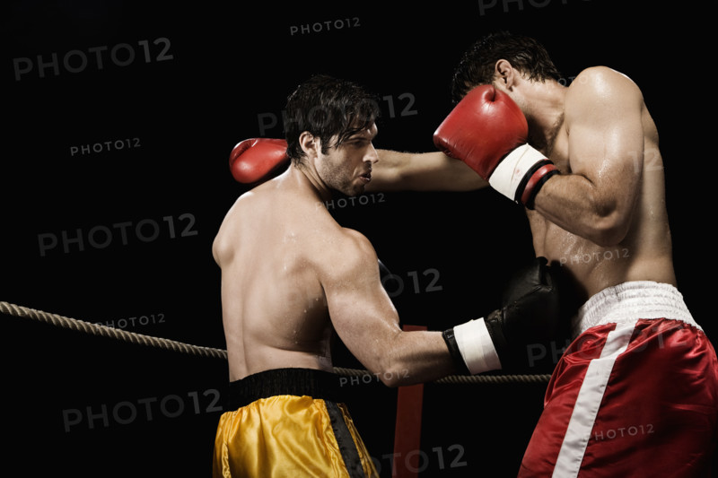Boxers fighting in boxing ring. Date: 2008