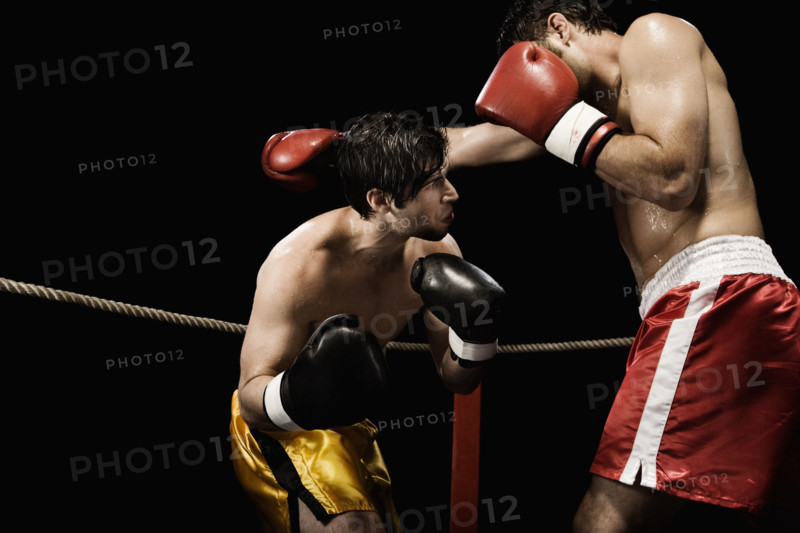 Boxers fighting in boxing ring. Date: 2008