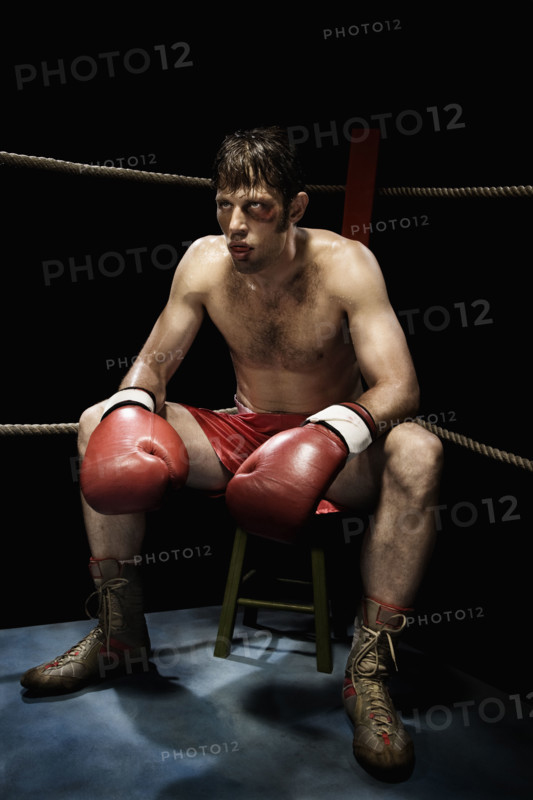 Boxer sitting on stool in corner of boxing ring. Date : 2008