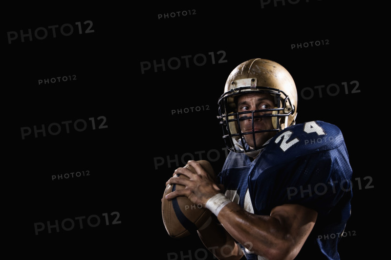 Quarterback preparing to throw football. Date: 2008