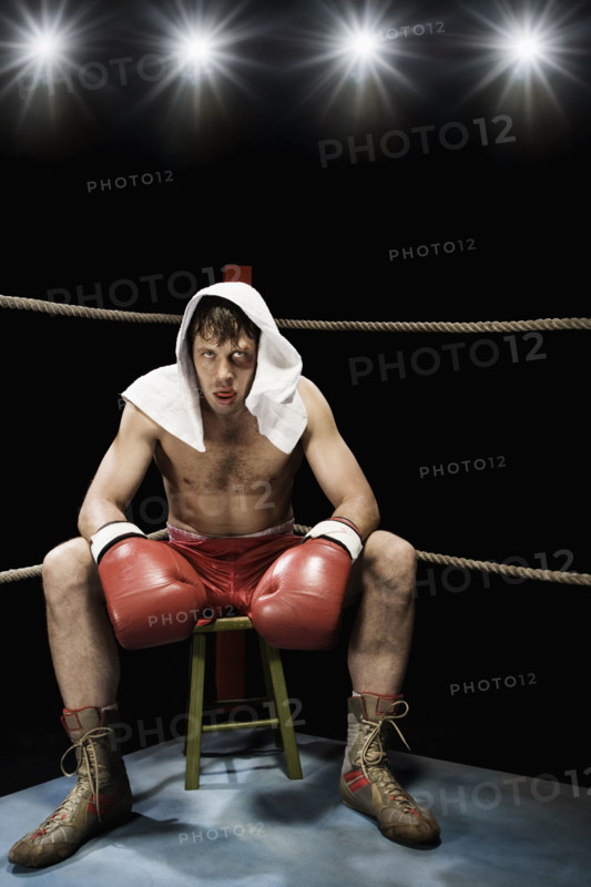 Boxer sitting on stool in corner of boxing ring. Date : 2008