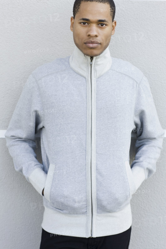 Portrait of young man leaning against wall. Date: 2008