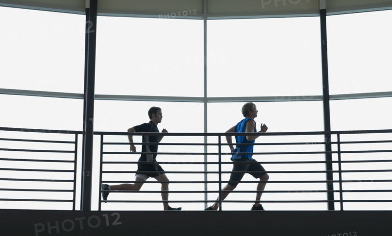 Men running on indoor track. Date : 2008