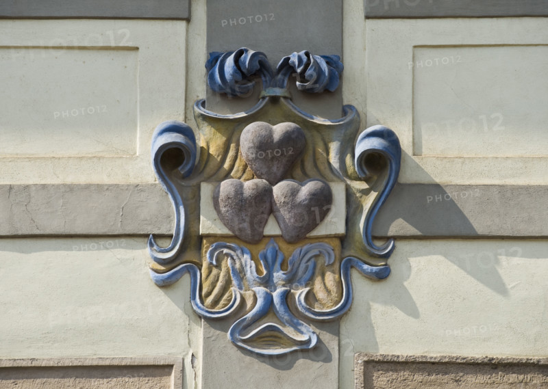 Close up of heart emblem on house.