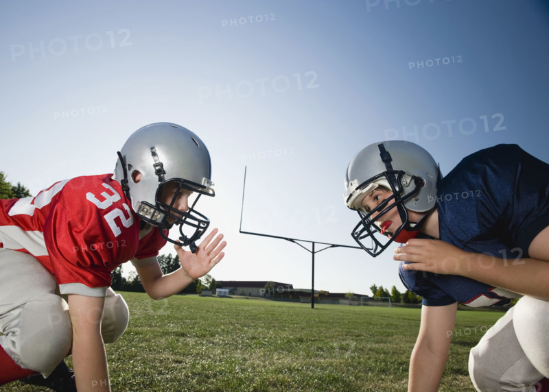 Opposing football players facing at line of scrimmage. Date: 2008