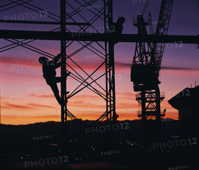 Workers climbing towers of construction site in Las Vegas. Date: 2008
