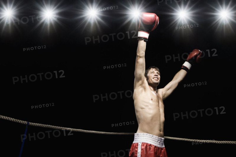 Boxer standing in boxing ring with gloves raised. Date : 2008