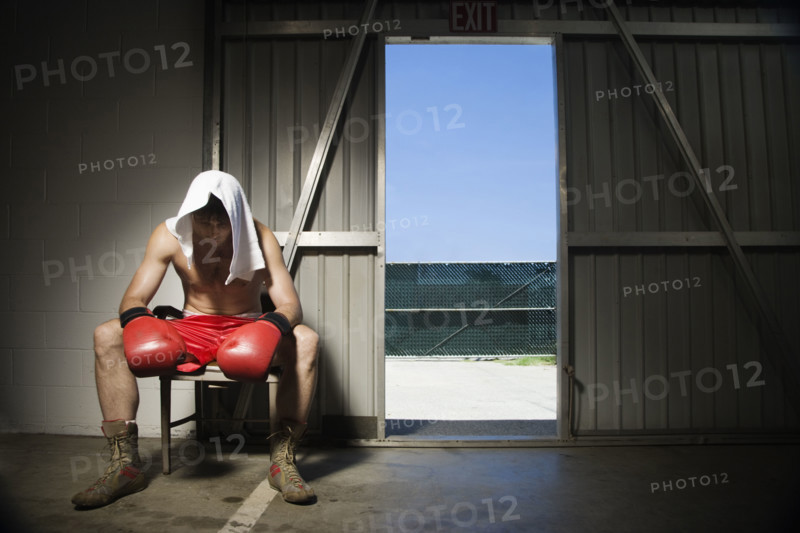 Boxer sitting on stool near doorway. Date : 2008