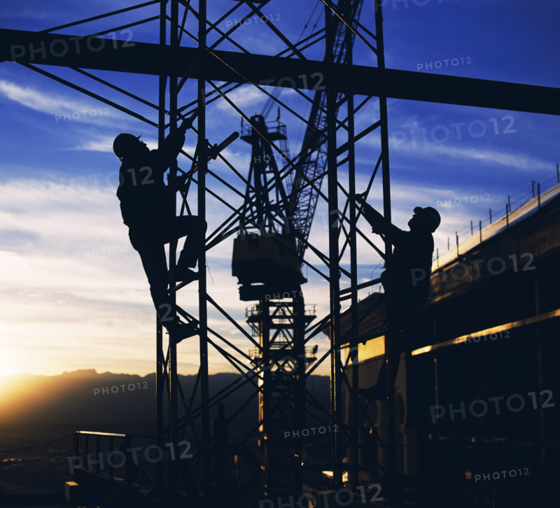 Workers climbing towers of construction site in Las Vegas. Date: 2008