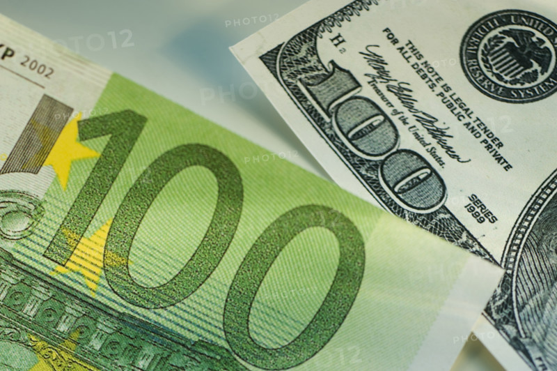 One hundred dollar bill and one hundred euro bill.