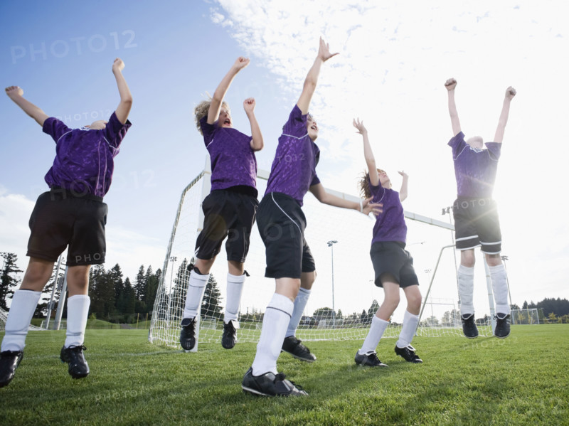 Boys soccer team celebrating on field. Date: 2008